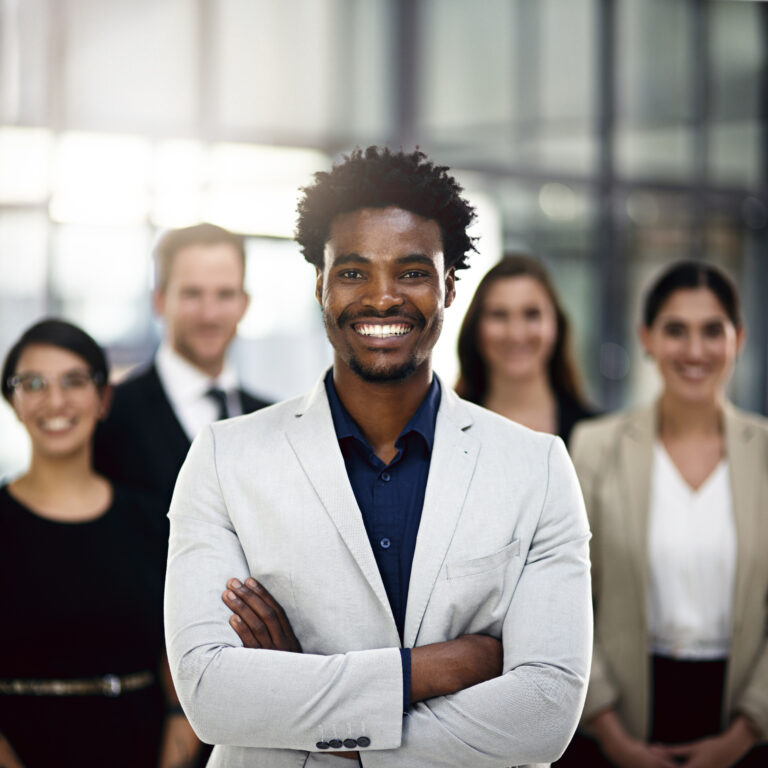 Cropped portrait of a group of businesspeople standing in the office.